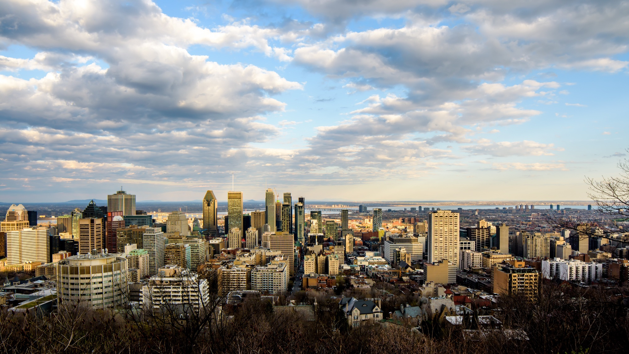 City of Montreal, Quebec, Canada view of cityscape high angle view background sky clouds at sunset