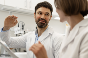 Scientists discussing during medical research in laboratory