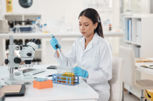 Shot of a young scientist working with samples in a lab